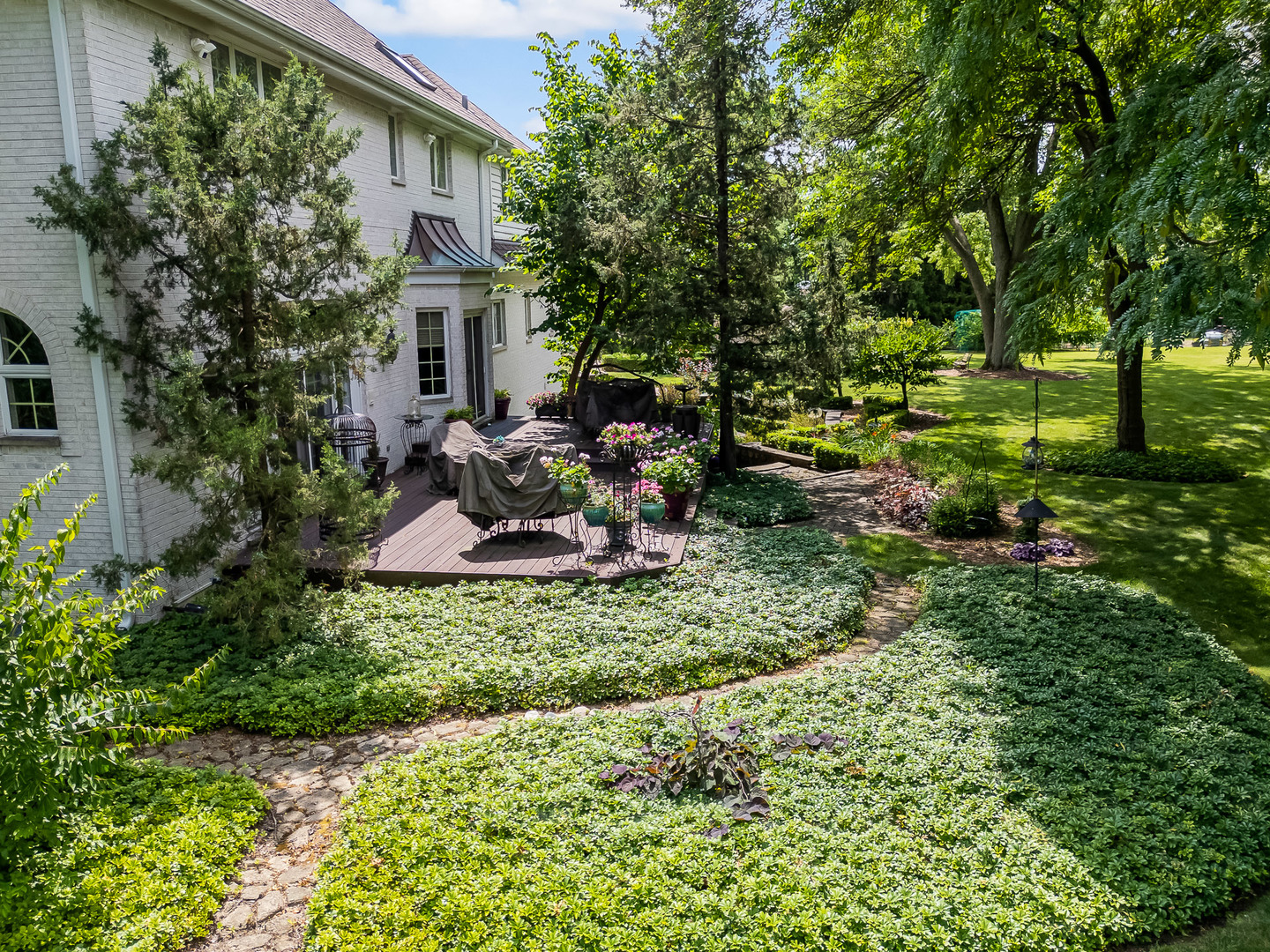540 Ridgemoor Drive Willowbrook, IL 60527 - Photo 60 of 62 a view of backyard with a table and chairs and potted plants