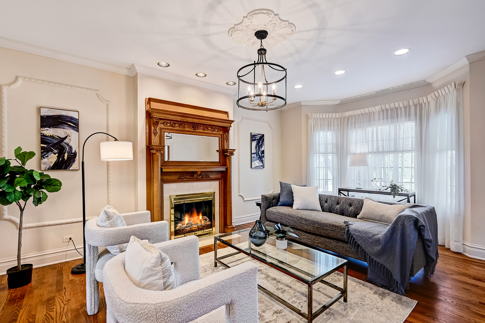 540 Ridgemoor Drive Willowbrook, IL 60527 - Photo 7 of 62 a living room with furniture chandelier and fireplace