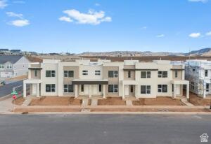 907 West Bright Ridge Ln Street, Unit 1430 St. George, UT 84790 - Photo 1 of 19 Modern townhome row featuring a neutral color palette