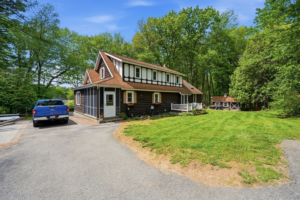 43 Flint Road Tyngsborough, MA 01879 - Photo 2 of 40 a house view with a garden space