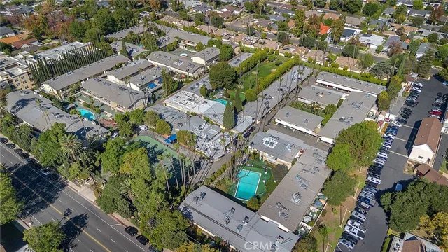 an aerial view of residential houses with outdoor space