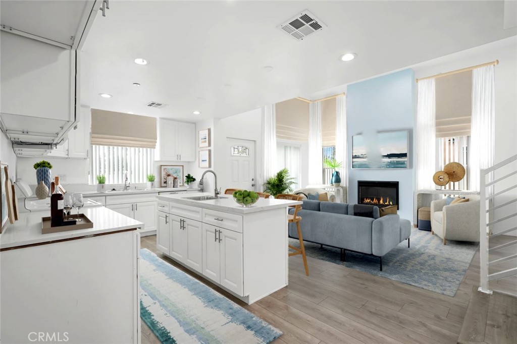 14241-1 Magnolia Boulevard Sherman Oaks, CA 91423 - Photo 6 of 16 a kitchen with living room and fireplace