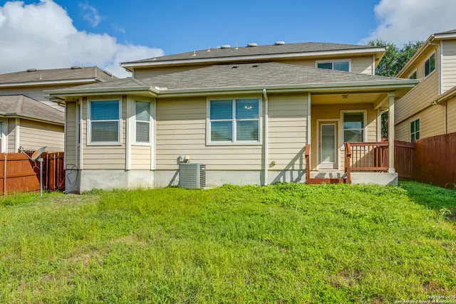 a view of a house with a backyard