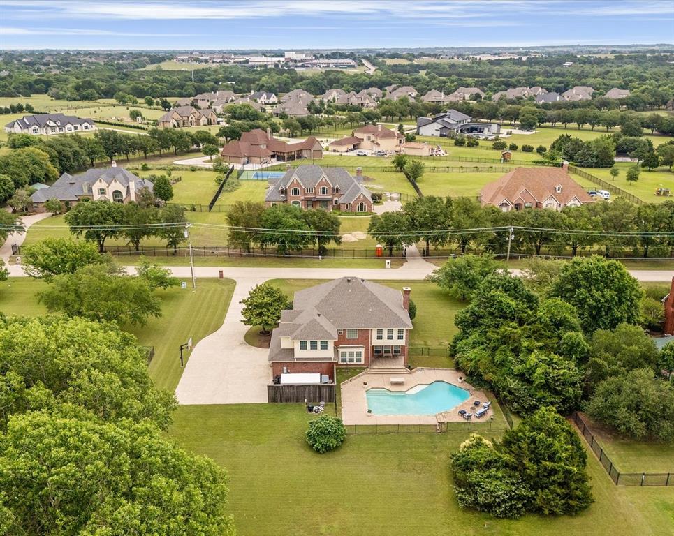 506 Meadowview Road Heath, TX 75032 - Photo 9 of 32 an aerial view of a house with yard swimming pool and outdoor seating