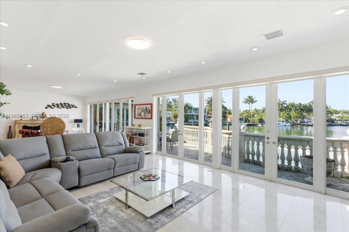 1249 Biscaya Drive Surfside, FL 33154 - Photo 13 of 88 a living room with furniture and a large window