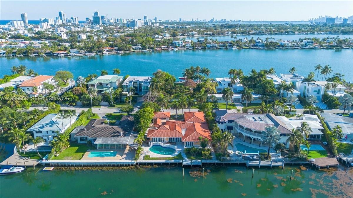 1249 Biscaya Drive Surfside, FL 33154 - Photo 2 of 88 an aerial view of residential houses with outdoor space and lake view