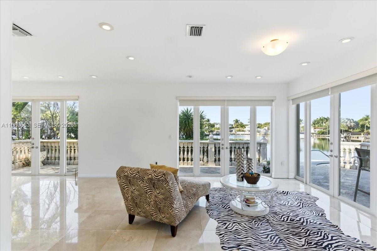 1249 Biscaya Drive Surfside, FL 33154 - Photo 30 of 88 a living room with furniture and a large window