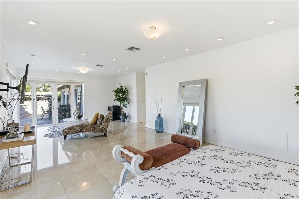 1249 Biscaya Drive Surfside, FL 33154 - Photo 32 of 88 a living room with furniture window and wooden floor