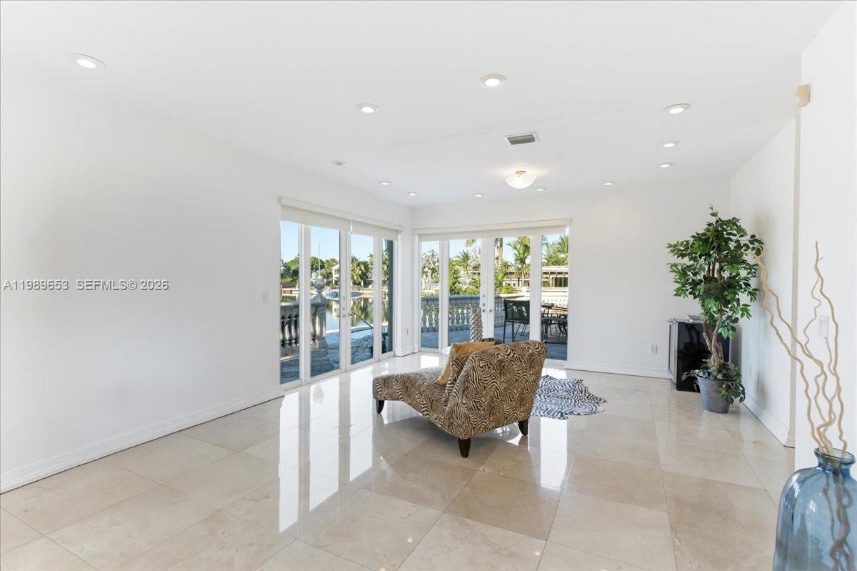1249 Biscaya Drive Surfside, FL 33154 - Photo 35 of 88 a living room with furniture and a potted plant