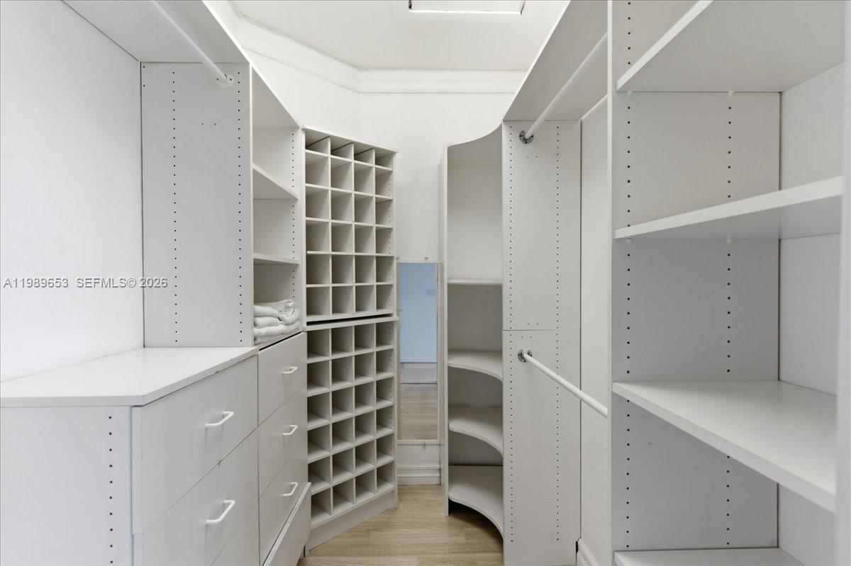 1249 Biscaya Drive Surfside, FL 33154 - Photo 38 of 88 a view of walk in closet with empty racks