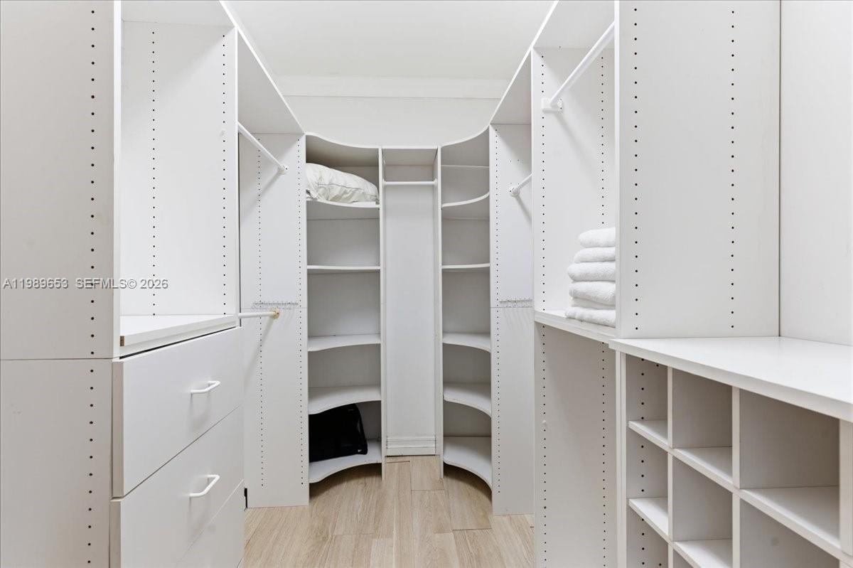1249 Biscaya Drive Surfside, FL 33154 - Photo 44 of 88 a view of walk in closet with empty racks