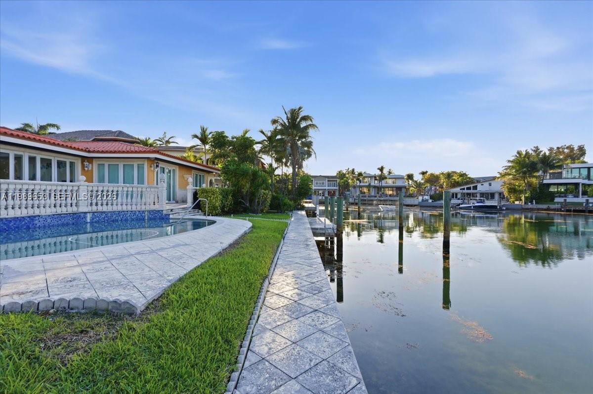 1249 Biscaya Drive Surfside, FL 33154 - Photo 65 of 88 a view of a lake with a yard
