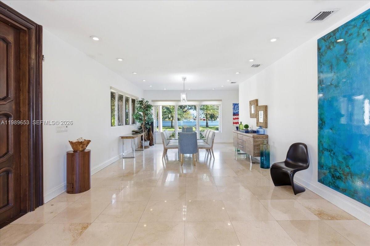 1249 Biscaya Drive Surfside, FL 33154 - Photo 7 of 88 a dining room with furniture and a floor to ceiling window