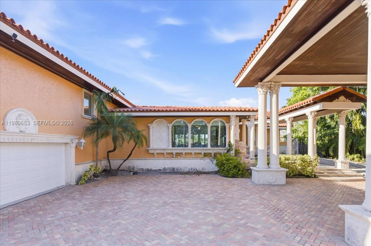 1249 Biscaya Drive Surfside, FL 33154 - Photo 76 of 88 a view of a house with a patio
