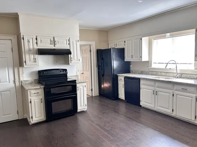 a kitchen with stainless steel appliances a refrigerator sink and stove