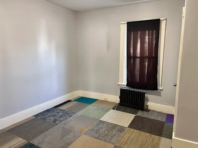 a view of wooden floor in an empty room