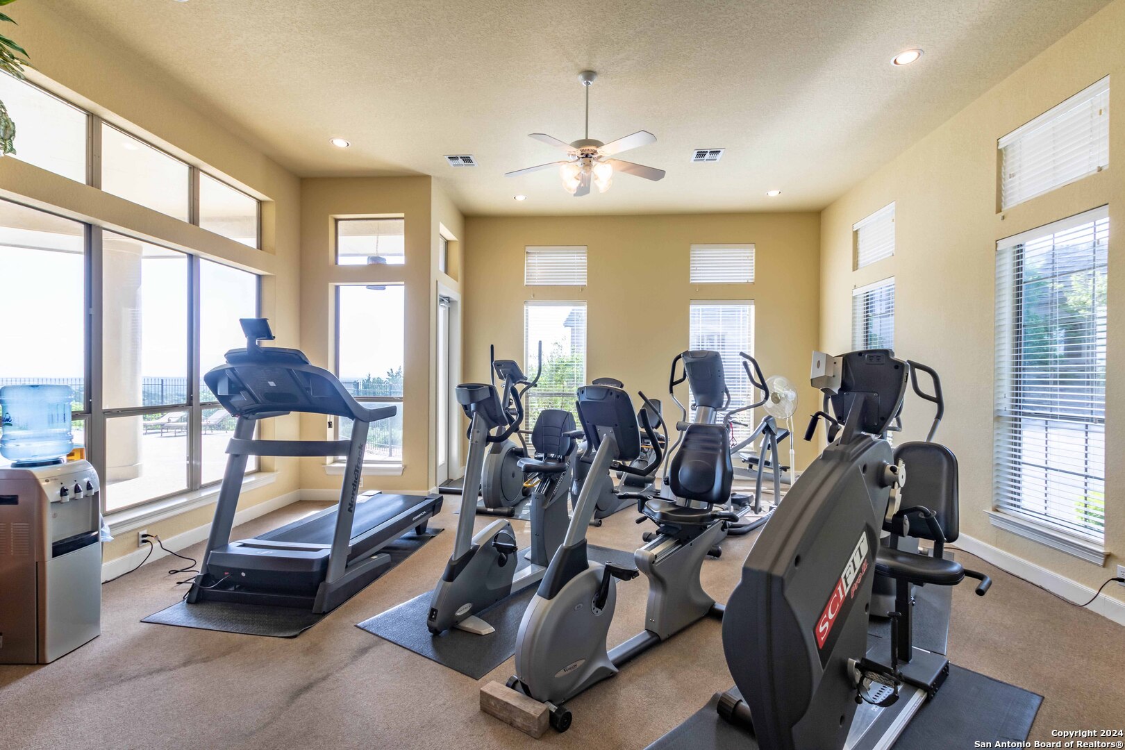 115 Towne View Circle Boerne, TX 78006 - Photo 16 of 19 a room with gym equipment and large windows