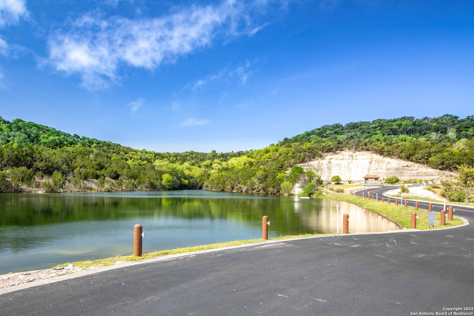 115 Towne View Circle Boerne, TX 78006 - Photo 19 of 19 a view of a lake with a house in the background