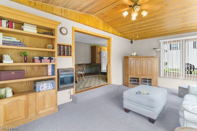 815 North Road Niles, OH 44446 - Photo 15 of 27 Carpeted living room with wood ceiling, ceiling fan, and vaulted ceiling