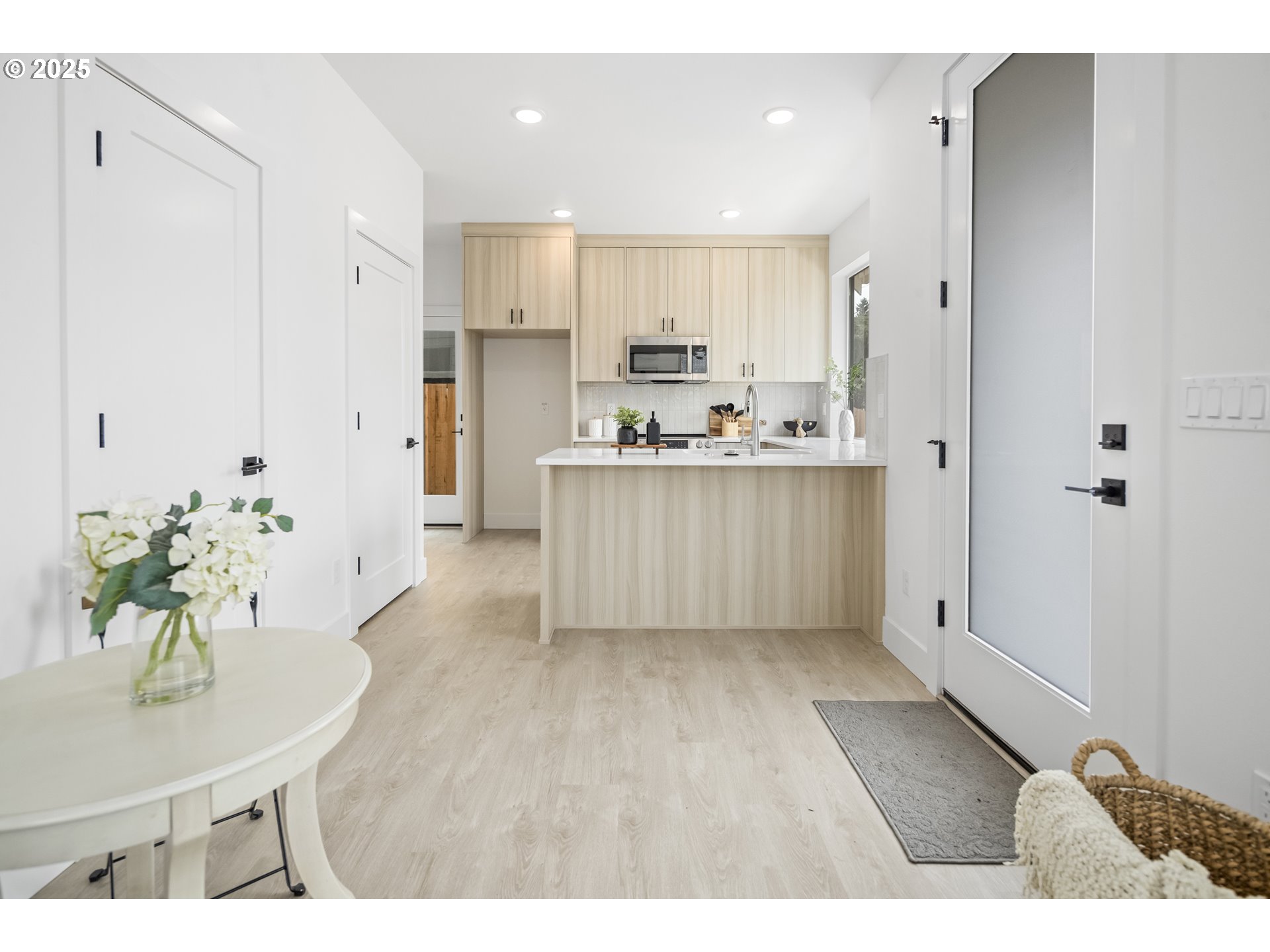 4732 Southeast 65th Avenue Portland, OR 97206 - Photo 13 of 16 a living room with kitchen island furniture wooden floor and refrigerator