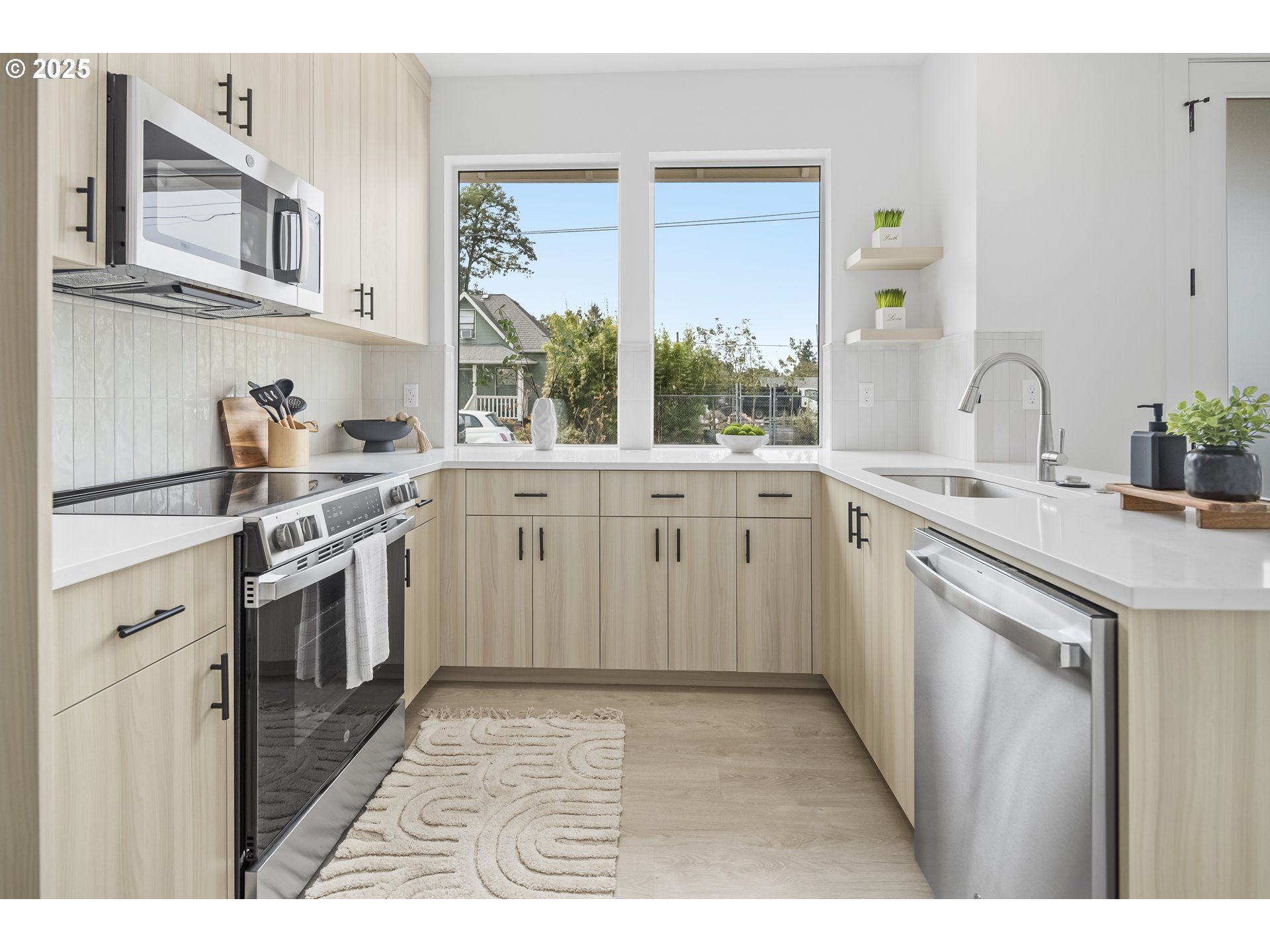 4732 Southeast 65th Avenue Portland, OR 97206 - Photo 3 of 16 a kitchen with a sink stove and cabinets