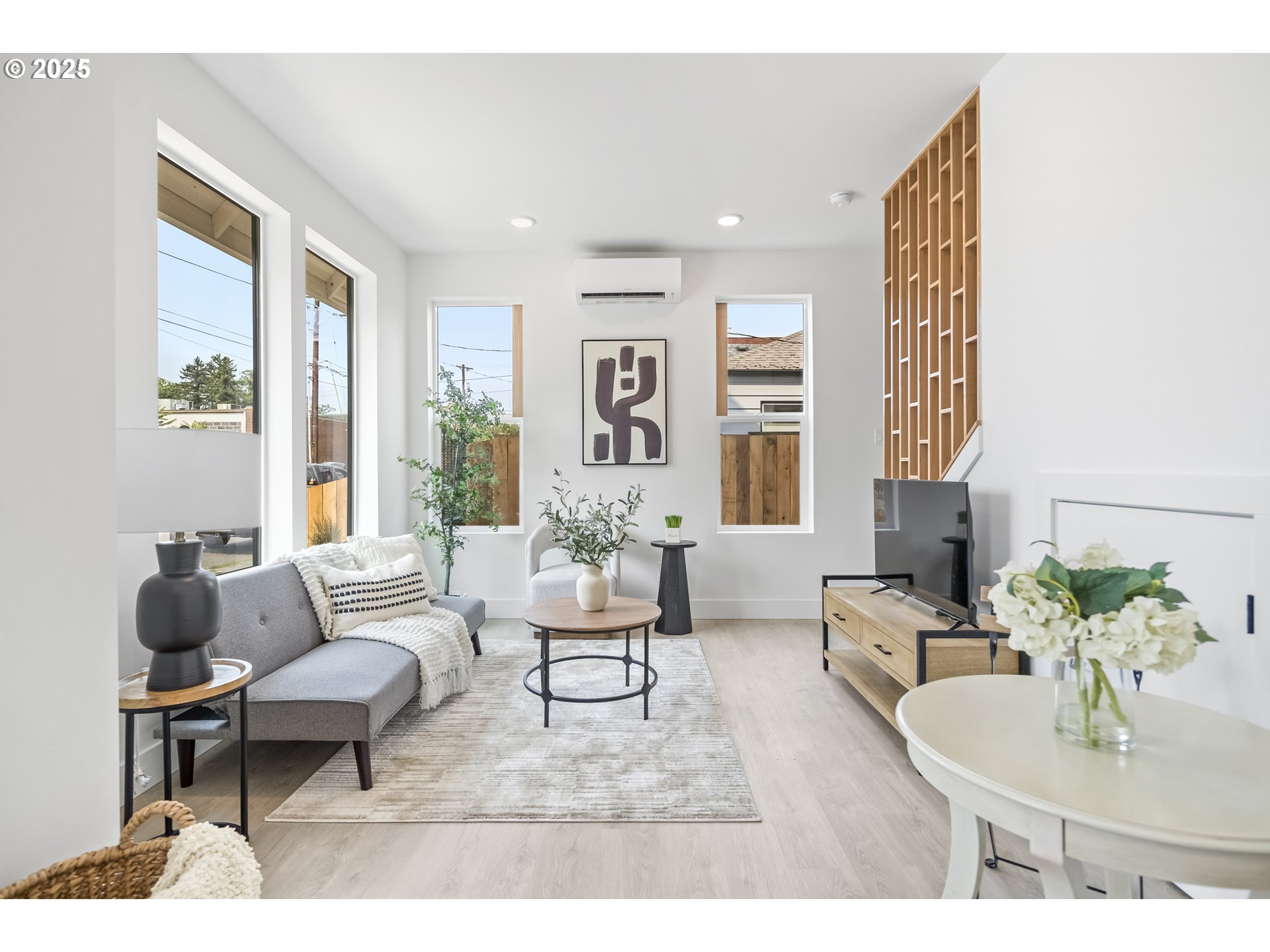 4732 Southeast 65th Avenue Portland, OR 97206 - Photo 7 of 16 a living room with furniture and large windows