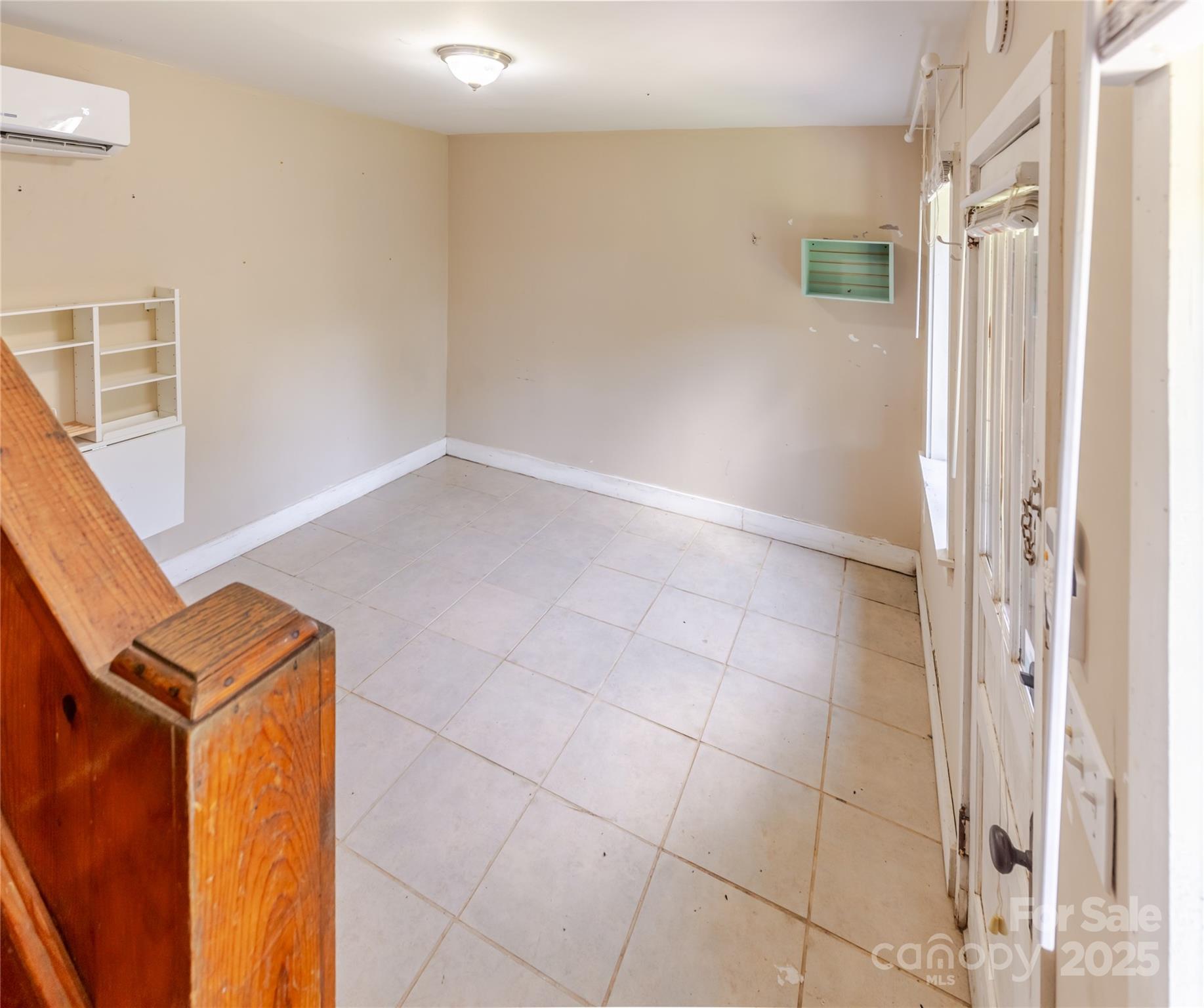 160 Observation Point Road Bryson City, NC 28713 - Photo 19 of 26 a view of an empty room with wooden floor and a window