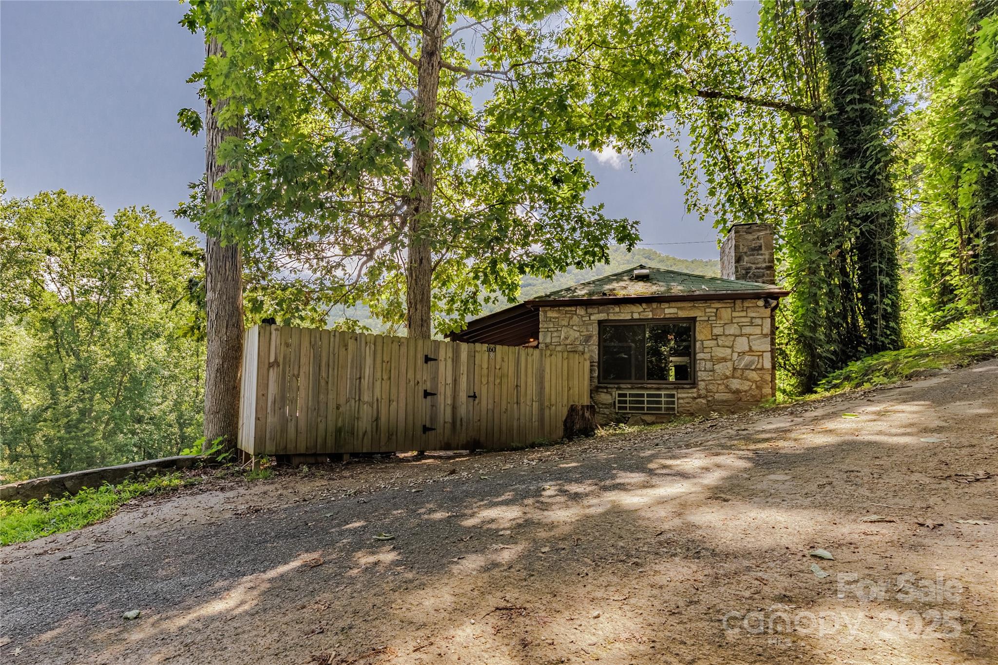 160 Observation Point Road Bryson City, NC 28713 - Photo 23 of 26 a front view of a house with a yard and garage