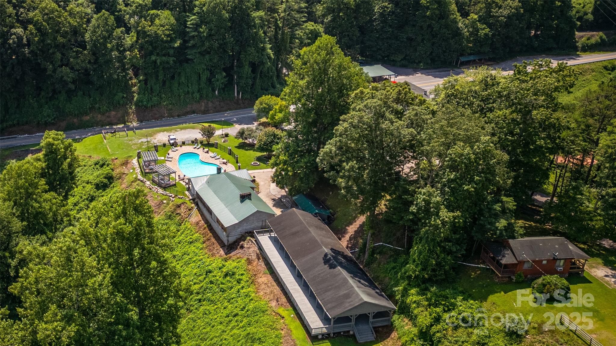 160 Observation Point Road Bryson City, NC 28713 - Photo 26 of 26 an aerial view of a house with swimming pool and garden
