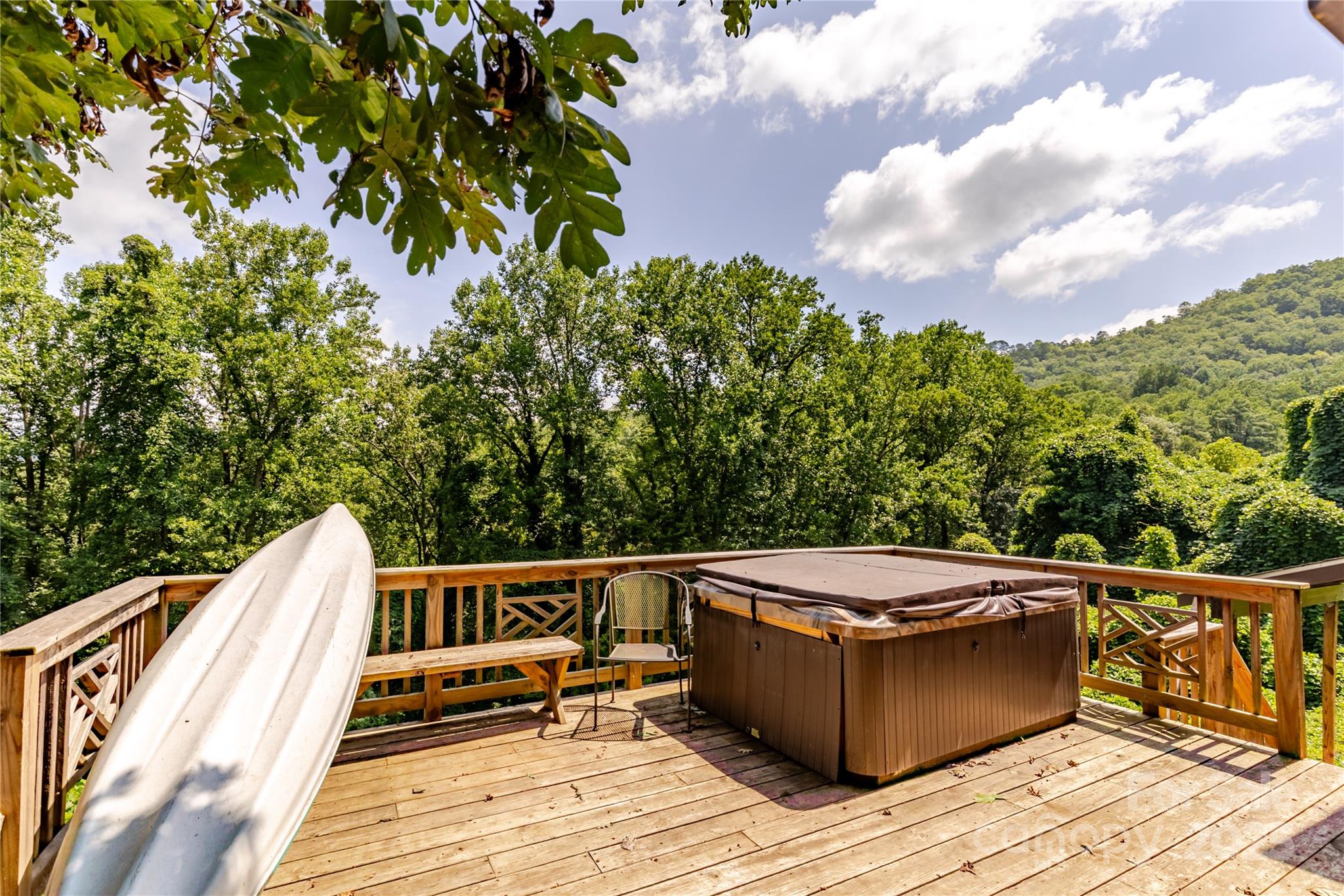 160 Observation Point Road Bryson City, NC 28713 - Photo 4 of 26 a view of roof deck with chairs and wooden floor