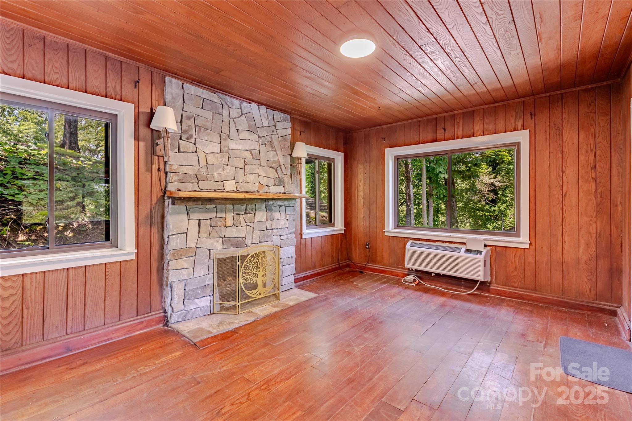 160 Observation Point Road Bryson City, NC 28713 - Photo 7 of 26 an empty room with windows fire place and outdoor space