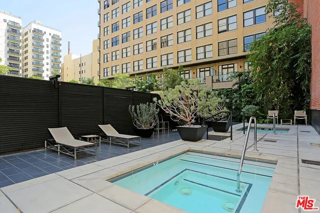 a living room with fireplace furniture and a flat screen tv
