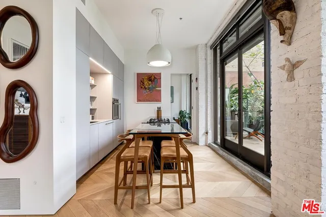 a view of a hallway with furniture and entryway
