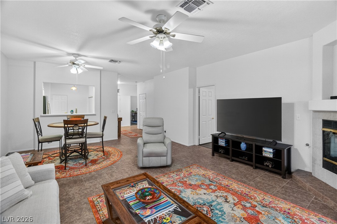 3376 Partridge Run Street Laughlin, NV 89029 - Photo 15 of 92 Step into a cozy living space featuring tile flooring and abundant natural light.