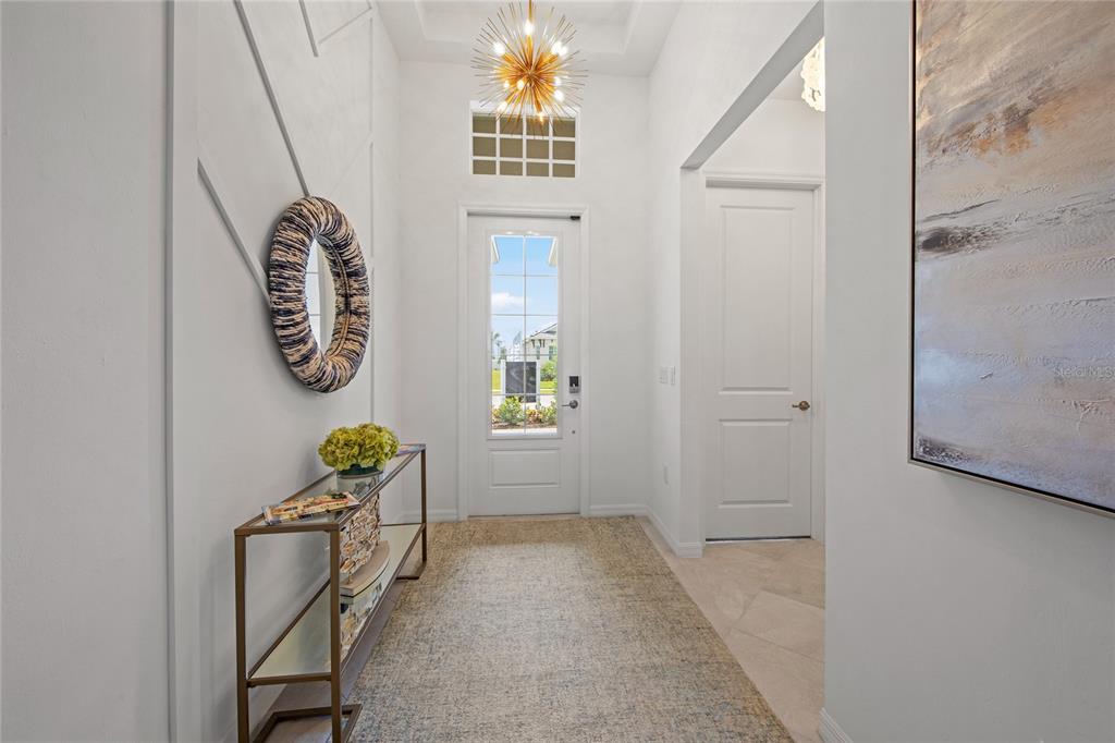 7161 Inlet Isles Lakewood Ranch, FL 34202 - Photo 3 of 29 a view of an entryway with wooden floor