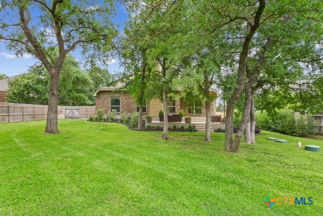 3306 Spring Canyon Road Belton, TX 76513 - Photo 39 of 40 a view of a house with backyard and a tree