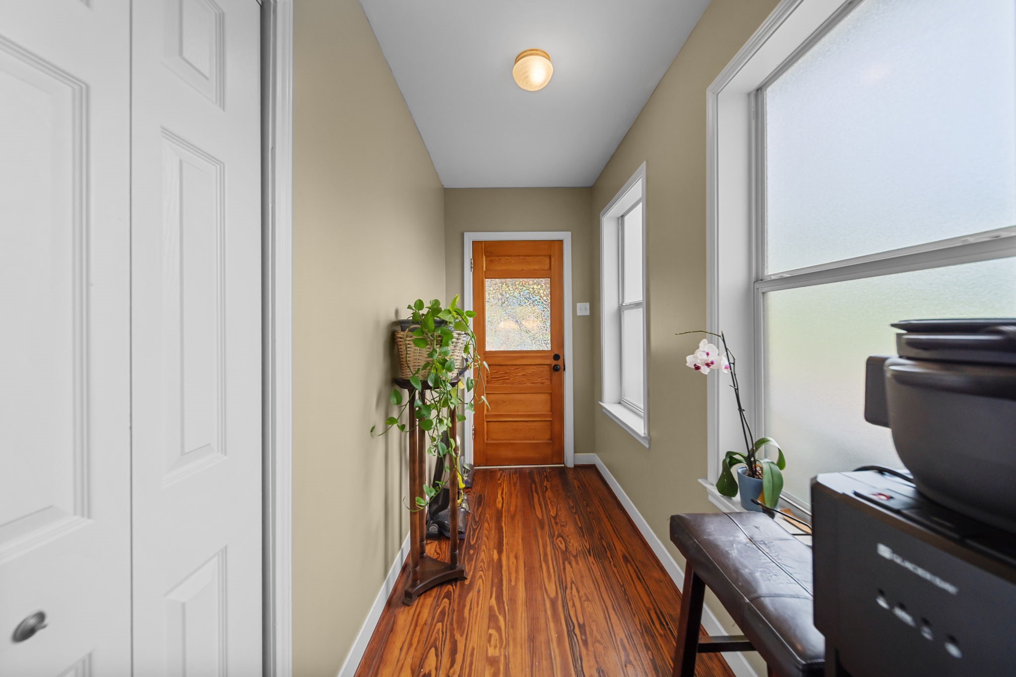202 Sweed Street Brenham, TX 77833 - Photo 11 of 34 a view of a hallway and wooden floor an entryway