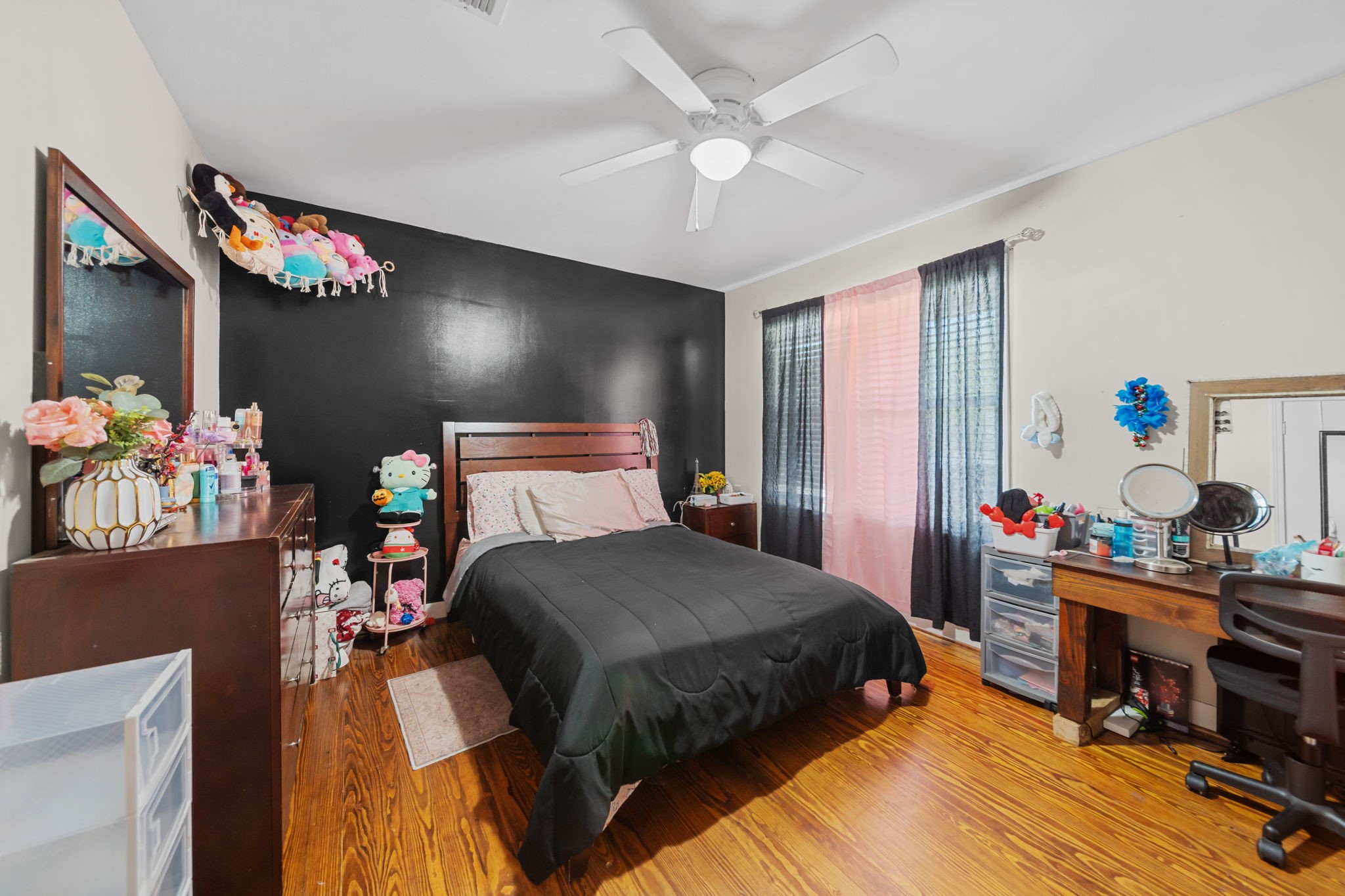 202 Sweed Street Brenham, TX 77833 - Photo 18 of 34 a bedroom with bed and a chandelier