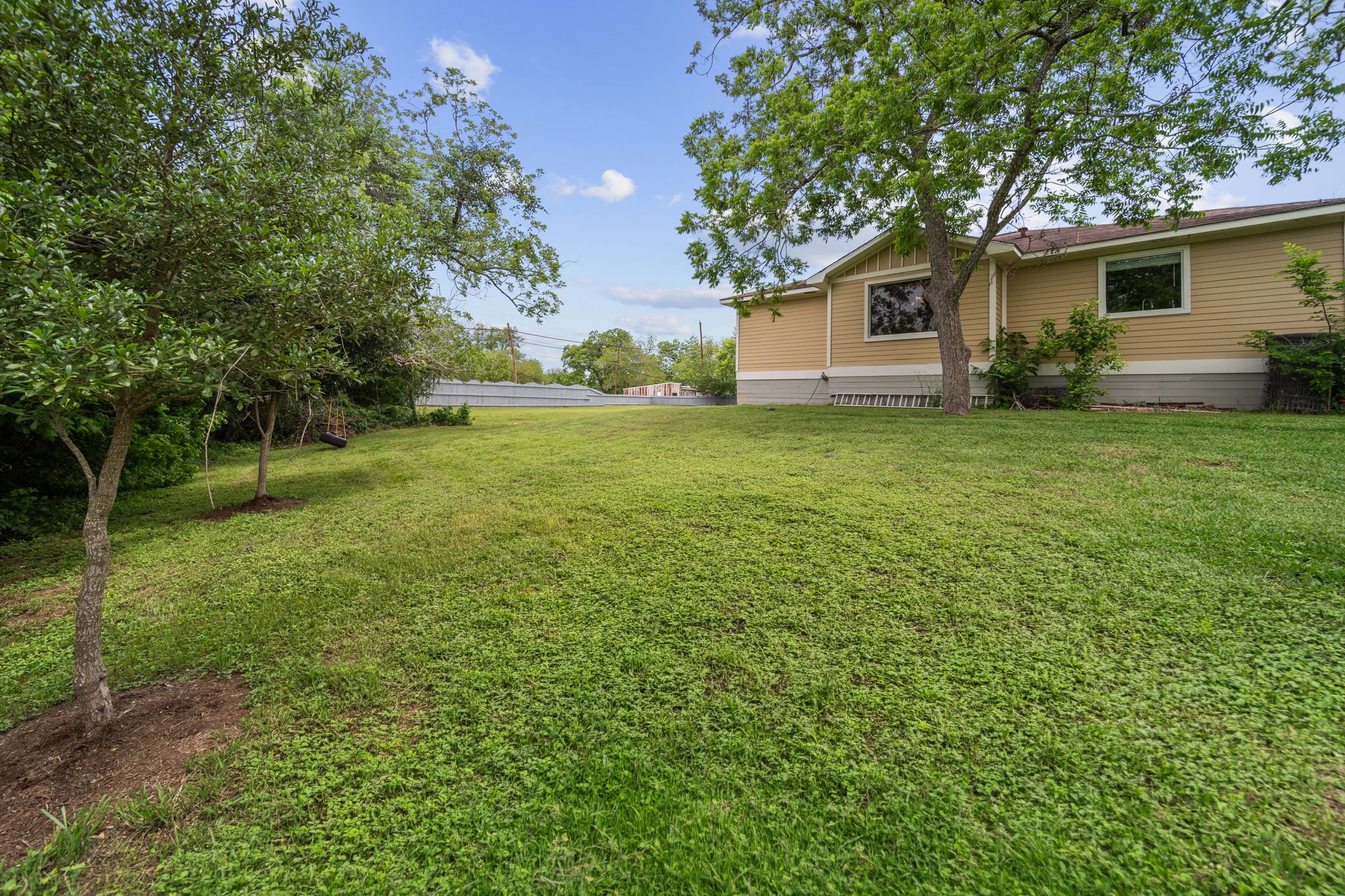 202 Sweed Street Brenham, TX 77833 - Photo 26 of 34 a view of a house with backyard and garden