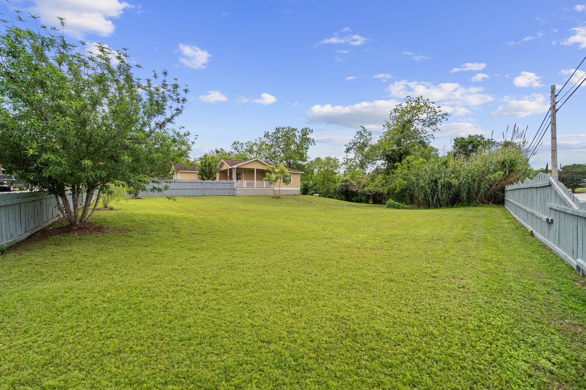 202 Sweed Street Brenham, TX 77833 - Photo 27 of 34 a view of yard with swimming pool and green space