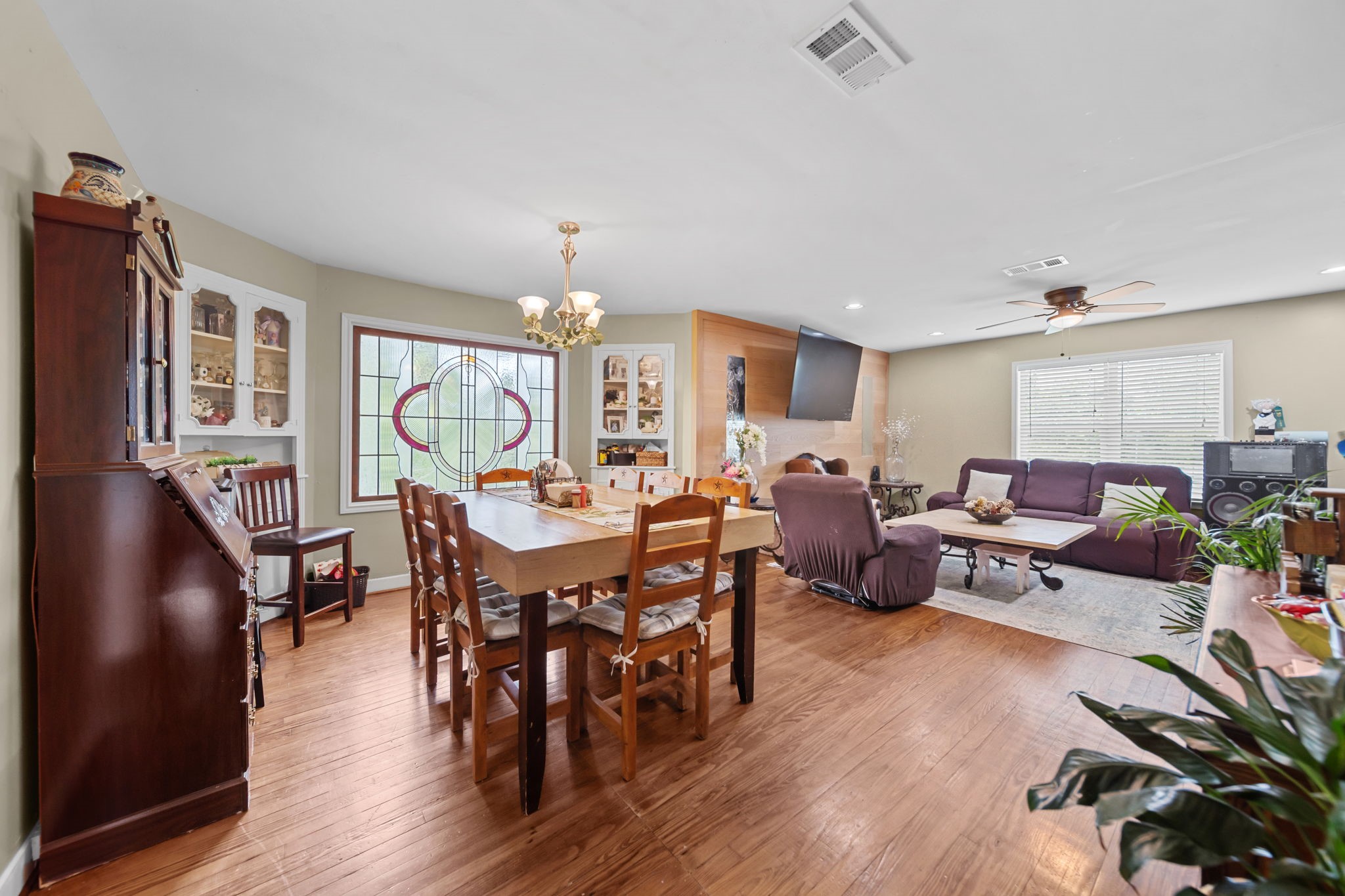 202 Sweed Street Brenham, TX 77833 - Photo 3 of 34 a living room with lots of furniture and a wooden floor