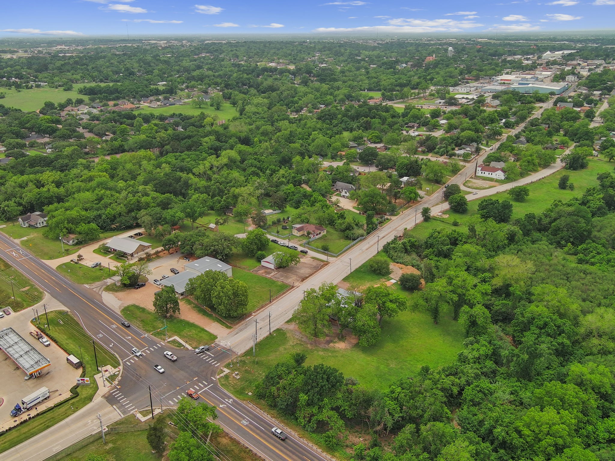 202 Sweed Street Brenham, TX 77833 - Photo 33 of 34 a view of a city street view with lush green forest