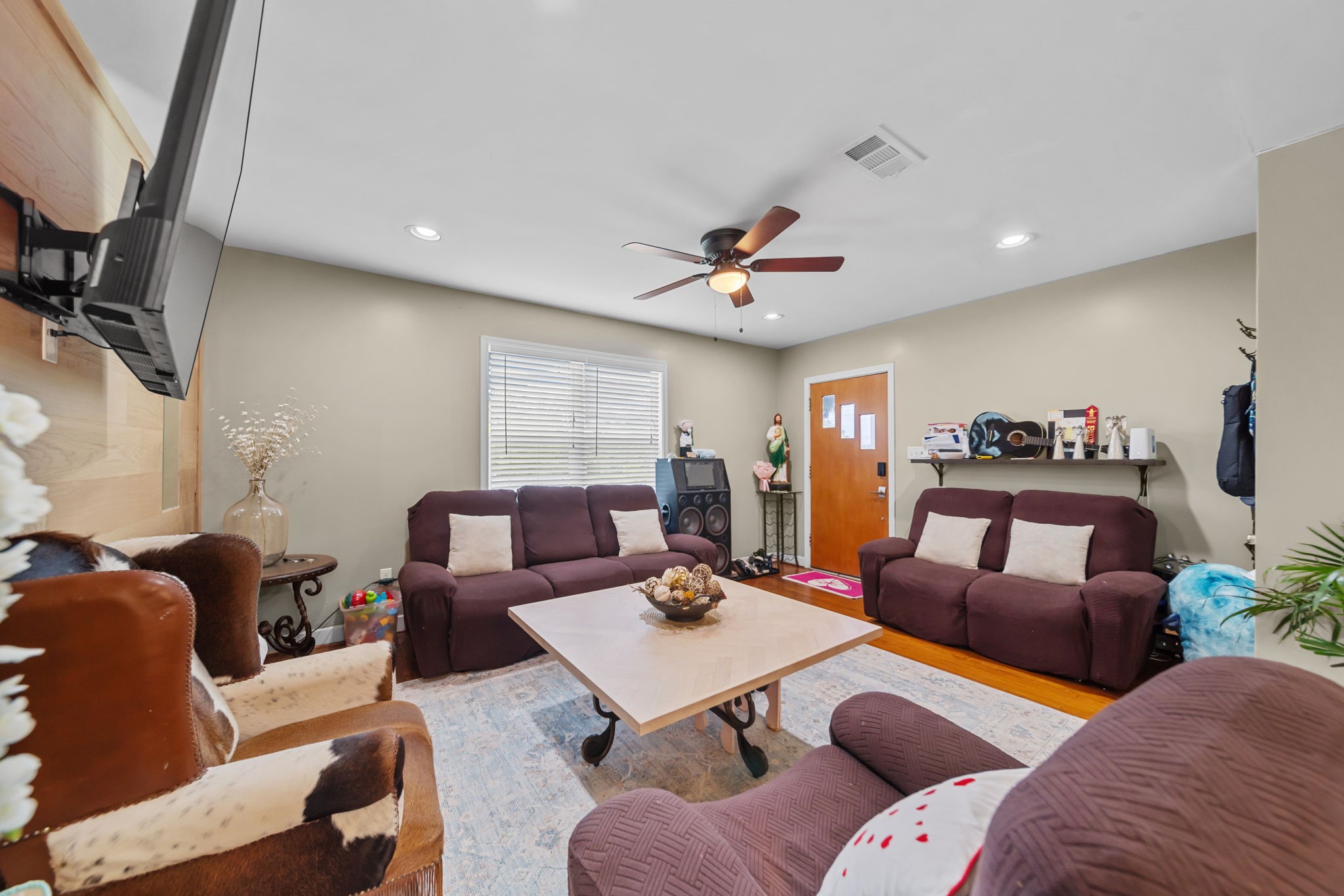 202 Sweed Street Brenham, TX 77833 - Photo 6 of 34 a living room with furniture and a large window