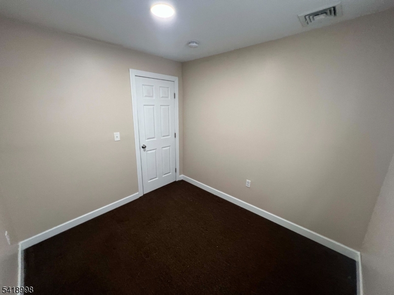 562 Summer Street Paterson, NJ 07501 - Photo 4 of 9 a view of an empty room