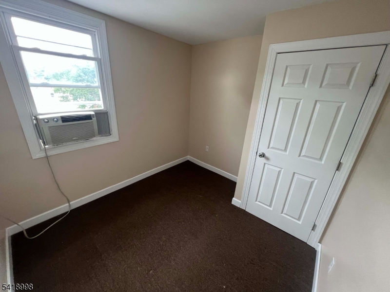 562 Summer Street Paterson, NJ 07501 - Photo 6 of 9 an empty room with a window