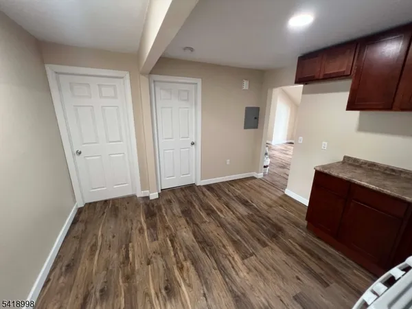 a view of kitchen and wooden floor