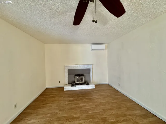 a view of a livingroom with wooden floor