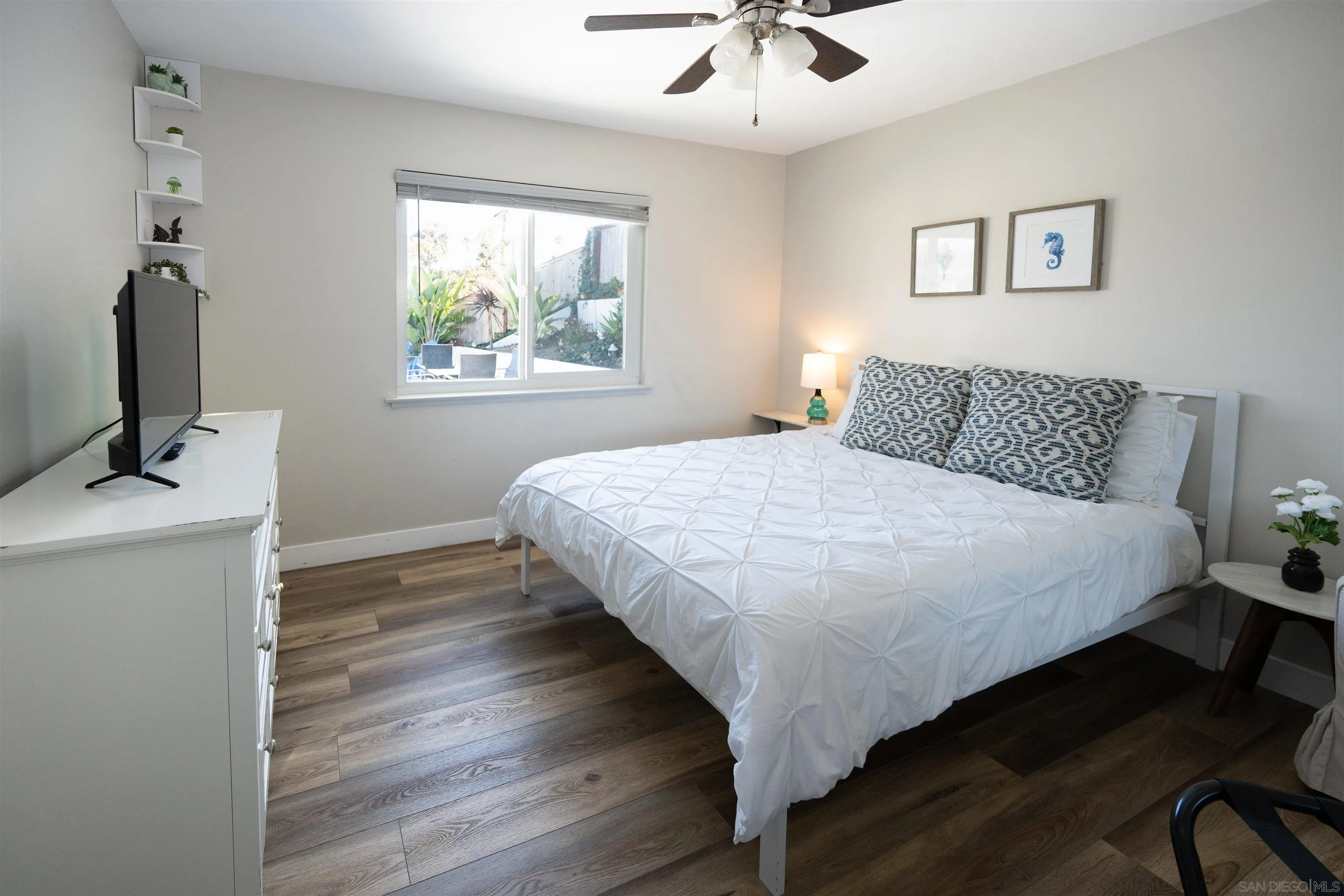 Undisclosed Address Oceanside, CA 92054 - Photo 11 of 19 a bedroom with a bed and a window