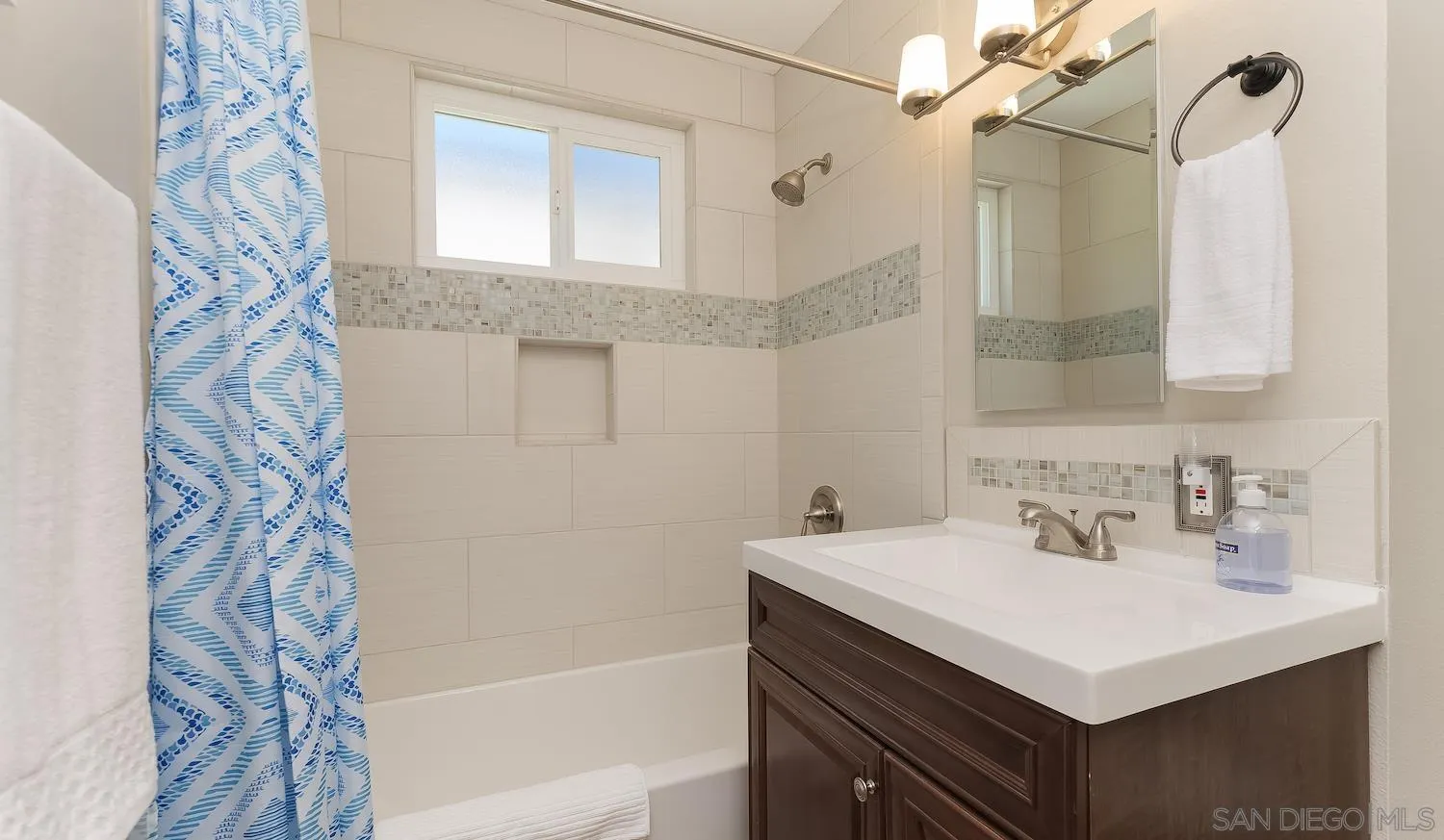 Undisclosed Address Oceanside, CA 92054 - Photo 14 of 19 a bathroom with a sink and a mirror