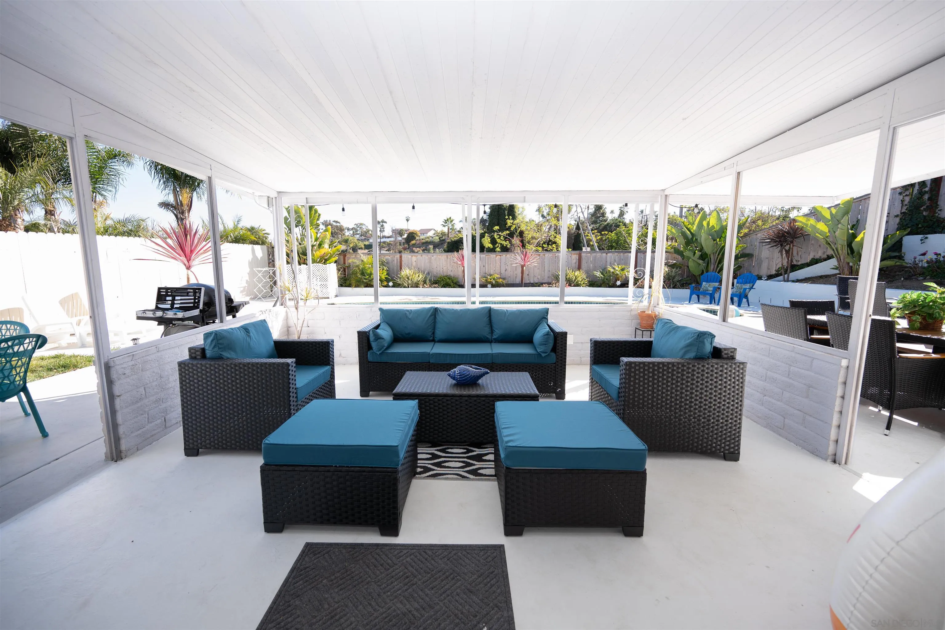 Undisclosed Address Oceanside, CA 92054 - Photo 16 of 19 a living room with furniture a flat screen tv and a floor to ceiling window